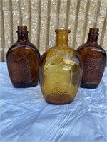 Vintage log cabin syrup bottles