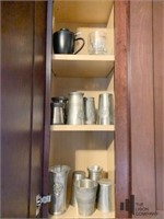 Contents of Cabinet with Pewter Cups and More