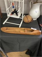 Primitive mini wooden canoe.