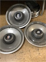 4 Buick hubcaps.;