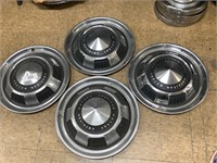 4 AMC hubcaps.