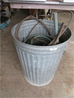 metal garbage can, cable, hose