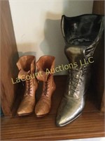 pair carved wood womens boots brass boot