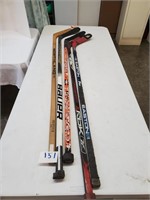 lot of 5 hockey sticks