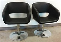 Pair of modern black leather swivel chairs - like