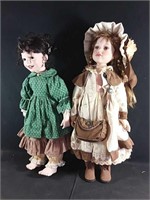 2 quality crafted porcelain dolls 26"h