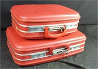 Set of 2 red vintage hard-sided suit cases/keys