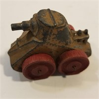 Antique cast metal toy tank with wooden Wheels