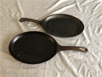 Two Oval Cast Iron Skillets