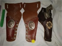 3 holsters with toy gun
