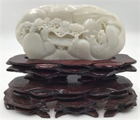 Chinese White Jade Carving on a Stand.