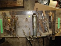lot of tools , grease gun , file , wrenches etc