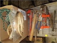 lot of pipe clamps , ropes , hammer , plyers etc