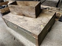 wooden crate with military items , possibly