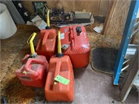 3 Gas Cans and Boat Motor Gas Tank