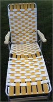 vintage yellow and white webbed chaise lounge
