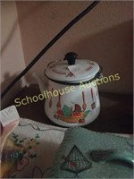 Enamel ware teapot with coin sleeves