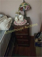 3 drawer night stand and plastic lamp. Clocks not