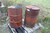 2 55-GAL. STEEL DRUMS AND CEMENT SLAB