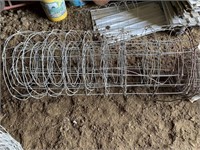 Two used bundles of fixed knot cattle fencing,