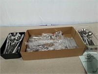A good number of pieces of flatware various