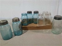 Blue and clear canning jars some with zinc lids