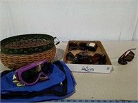 Several various brand sunglasses including