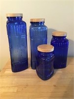 4 Blue Glass Canisters