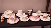 Eight vintage cups and saucers, highly decorated;