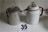 2 coffee pots - 1 aluminum and 1 enamelware