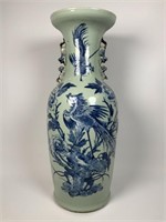 Tall Asian style blue and white decorated vase