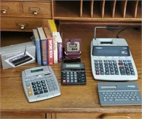 Desk lot, calculators, adding machine, clock,