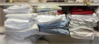 Assortment of sheets, pillowcases, mattress