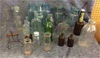 Assortment of glass jars including milk bottles,