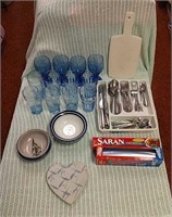 Kitchen supplies - silverware, cutting board,