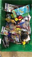 Green tote of misc toys