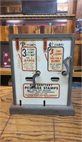 Antique postage stamp dispenser.