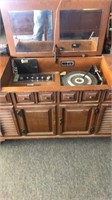 vintage stereo, 8 track player, and turntable cabn