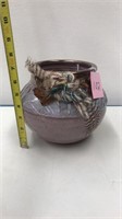 Pottery with feathers