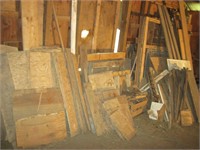 Lot of Wood along wall in upper level of barn