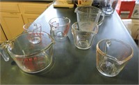 Six Pyrex Measuring Cups