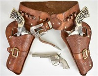 VINTAGE LEATHER CHILD HOLSTERS WITH TOY GUNS