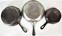 THREE ANTIQUE WAGNER WARE CAST IRON SKILLETS
