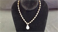 Vintage brown pearl necklace with water globe