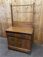 Antique oak commode with towel bar