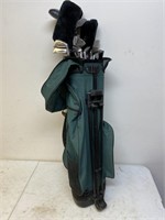 Green bag of golf clubs