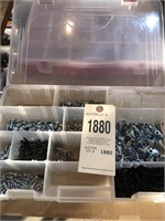 plastic bin with punches, screws, etc