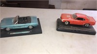 2 collectible cars- Camaro and mustang