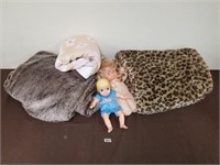 Two large blankets, one small blanket, two dolls