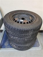 Set of three tires on rims
